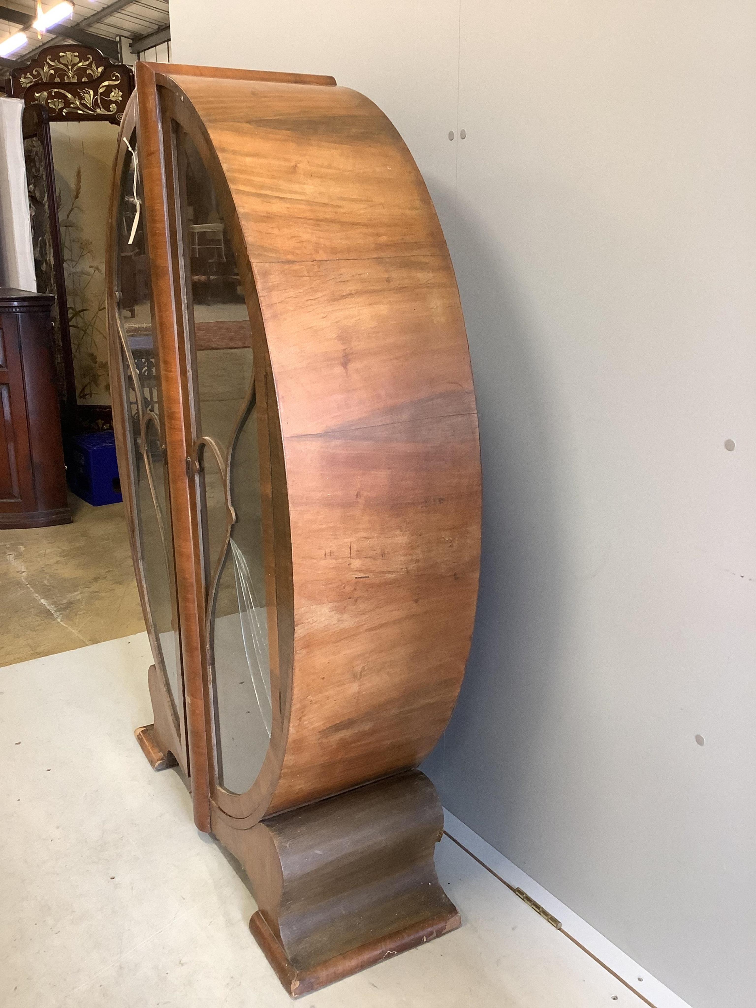 An Art Deco walnut display cabinet, width 98cm, depth 32cm, height 142cm. Condition - poor, one glass pane damaged